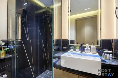 a bathroom with a sink and a shower at Cozy Studio in Binghatti Canal - Close to Downtown in Dubai