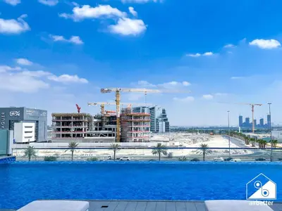 a view of a city with construction in the background at Serene Studio with Views in Al Waleed Garden 2 in Dubai