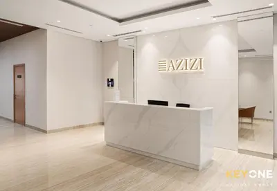 a lobby with an aviva sign on a wall at Chic Modern Studio in Azizi Riviera in Dubai