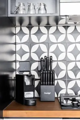 a kitchen counter with a coffee maker and appliances on it at Fresh & Stylish 2br Living At Collective Tower 1 in Dubai