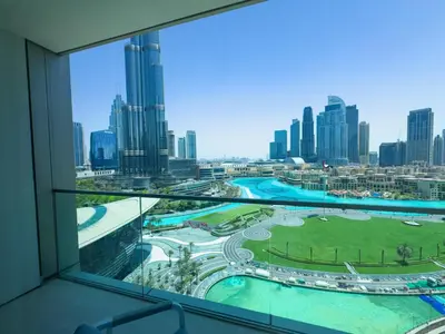 a view of the city from a hotel window at GRANDE SIGNATURE with a direct Burj Khalifa view and Private Fountain Show with DXB AIRPORT VIP Shuttle option for 8 guests in Dubai