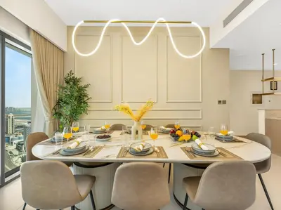 a dining room with a table and chairs at Panoramic Burj Khalifa Views at Burj Royale by Propigo in Dubai
