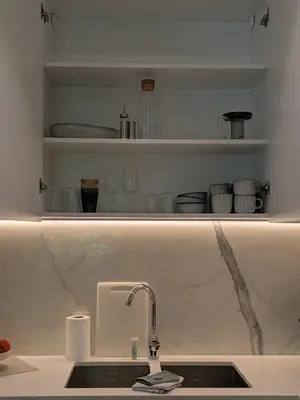 a kitchen counter with a sink and a shelf at Stylish Urban-Jungle-Studio in Al Barari, Dubai in Dubai