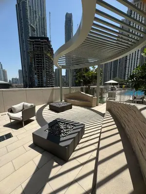 a patio in a city with buildings in the background at KING 2BR LUX Apt-5mins Dubai Mall-Downtown Dubai in Dubai