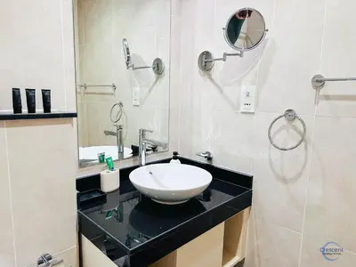 a bathroom with a sink and a mirror at Luxurious Studio in Damac Hills in Dubai