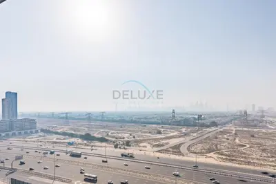 an aerial view of a highway with cars on it at Skyline-View 1BR with Balcony,Minutes to Downtown and Marina, Binghatti Onyx, Jumeirah Village Circle by Deluxe Holiday Homes in Dubai