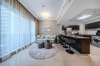 a large room with a kitchen and a living room at 1 BD in Bay Central with the Iconic Marina Views in Dubai