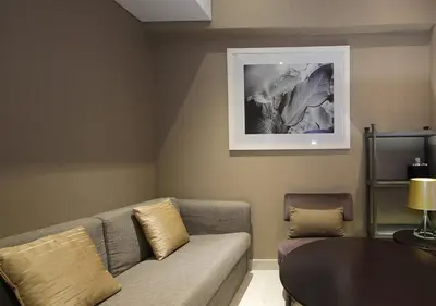 a living room with a couch and a table at Luxury Damac Studio w Canal View Near Burj Khalifa in Dubai