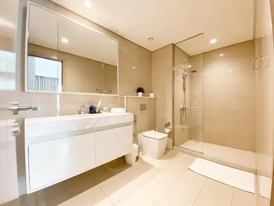 a bathroom with a sink and a toilet and a shower at Majestic Burj Khalifa View 2BR Premium Apartment By SBH in Dubai