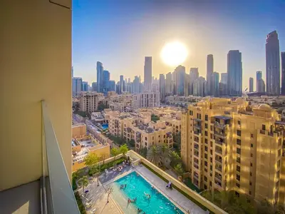 a view of a city skyline with a swimming pool at Majestic Burj Khalifa View 2BR Premium Apartment By SBH in Dubai