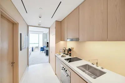 a kitchen with a sink and a counter at Exquisite studio - Highest at the Palm Tower in Dubai