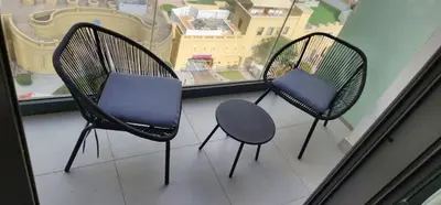 two chairs sitting in front of a window at New luxury Studio at Prestigious Liv Residence in Dubai