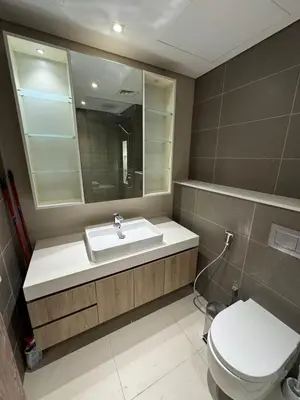 a bathroom with a sink and a toilet at New luxury Studio at Prestigious Liv Residence in Dubai