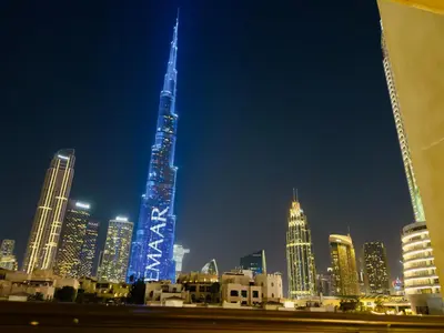 a view of a city skyline at night at Live the Burj Lifestyle in Timeless OldTown by SBH in Dubai