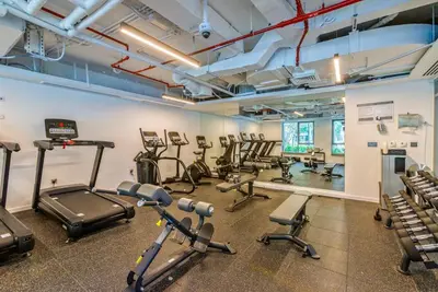 a gym with several exercise bikes and treadmills at Arabian Nights 1BR - Burj Khalifa & Fountain Views - 5 Mints Walk to Burj Khalifa and Dubai Mall in Dubai