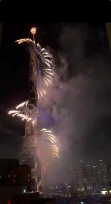 a fireworks display at the oriental pearl tower at night at Arabian Nights 1BR - Burj Khalifa & Fountain Views - 5 Mints Walk to Burj Khalifa and Dubai Mall in Dubai