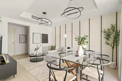 a living room with a glass table and chairs at Silkhaus Luxe 2 BDR with Maid room in Springs 7 Villa 14 in Dubai