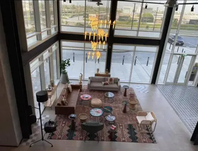 a living room with a couch and a table at Wonderful Stay at Collective 2- Unique in Dubai Hills - 5 min to Dubai Hills Mall - Brand New Luxury Apartments in Dubai