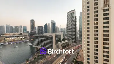 a view of a city with a river and buildings at Spacious and Bright Retreat in JBR in Dubai