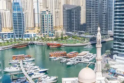 a view of a marina with boats in the water at 1BR Marina View Rooftop Pool Dubai Marina in Dubai