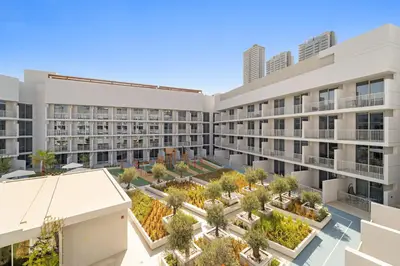 an aerial view of the courtyard of a building at VayK - Stylish & Cozy Studio in JVC in Dubai