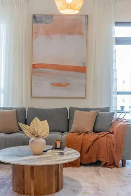a living room with a couch and a coffee table at Enchanting Stay in JBR Near The Beach in Dubai