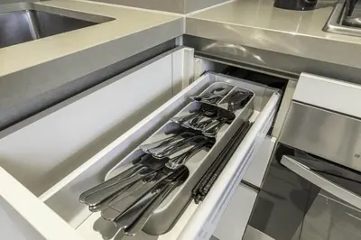a drawer in a kitchen with utensils at New 2BR with Pool and Gym in Green Sobha Community in Dubai