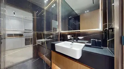 a bathroom with a sink and a mirror at Binghatti Onyx - Upgraded One Bedroom in JVC in Dubai