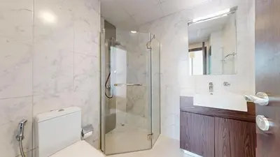 a bathroom with a shower and a toilet and a sink at Vacationer I Exclusive 2 Bedroom I Breathtaking Skyline & City Views I Afnan 1 - IMPZ in Dubai