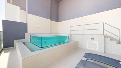 a bathroom with a large blue tub in a room at Binghatti Onyx - Two Bedroom with Private Pool in Dubai