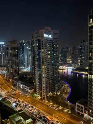 a view of a city at night with traffic at Horizon JBR in Dubai