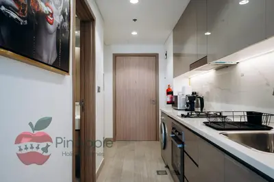 a kitchen with a sink and a counter top at Stylish studio in Azizi 42 in Dubai