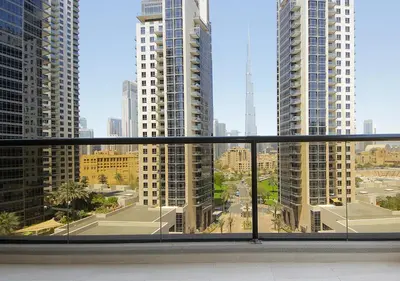 a view of a city from a balcony in a building at Luxury 3BR Apartment By Elite Residence Downtown in Dubai