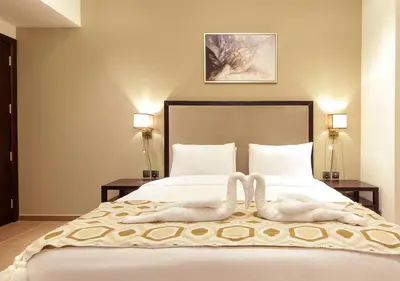 a bedroom with a bed with two towels on it at Luxury 3BR Apartment By Elite Residence Downtown in Dubai