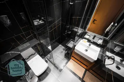 an overhead view of a bathroom with a toilet and sink at Fully furnished with stunning panoramic view in Dubai