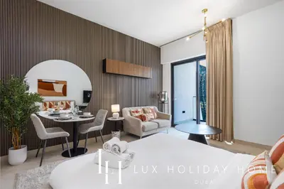 a living room with a bed and a dining room at LUX The Modern Binghatti Canal Suite 2 in Dubai