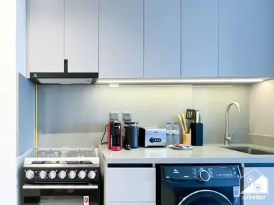 a small kitchen with a stove and a sink at Mag City 920 Modern Studio Minutes from Downtown in Dubai