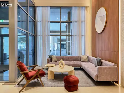 a living room with a couch and a table at bnbmehomes - Claren Tower in Dubai