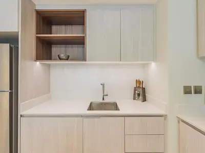 a kitchen with white cabinets and a sink at Beach Escape 1BR-Vida Residences Creek Beach in Dubai