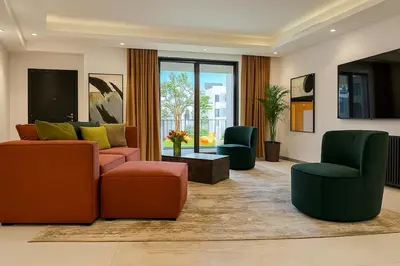 a living room with two couches and two chairs at Massive LuxXo Family & Friends Villa with Terraces, Private Parking, Pool & Quick Access to Dubai Mall in Dubai