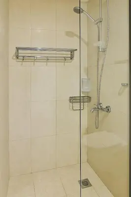 a bathroom with a shower with a glass door at Comfy Studio in JVC Great Location Fast Wi-Fi in Dubai