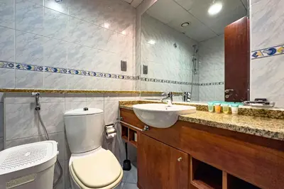 a bathroom with a toilet and a sink at Chill Studio with Balcony and Pool View in Dubai