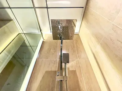 an elevator in a building with a glass ceiling at Brand New-Fully Furnished Classy Studio In JVC in Dubai
