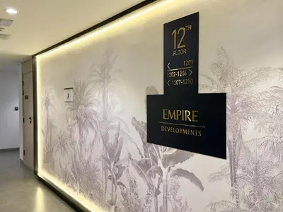 a wall with a mural of plants on it at Brand New-Fully Furnished Elegant 1BR In JVC in Dubai