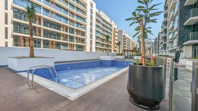 a swimming pool in the middle of a building at Frank Porter - Azizi Riviera 15 in Dubai
