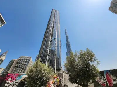 a view of two tall buildings in a city at City Vibe 1BR with Outdoor Space, Walking Distance to Burj Khalifa and Dubai Mall, Grande, Downtown Dubai by Deluxe Holiday Homes in Dubai