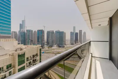 a view of a city from the balcony of a building at RH- Heart of Dubai Marina, Sunny & bright 2 BR apartment with big balcony in Dubai