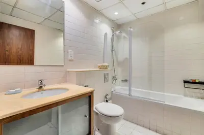 a bathroom with a sink and a toilet and a shower at GuestReady - Contemporary living in Dubai Marina in Dubai