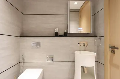 a bathroom with a sink and a mirror at Livbnb - Serene Studio with Private Terrace in JVC in Dubai