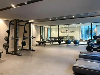a gym with treadmills and machines in a room at Livbnb - Serene Studio with Private Terrace in JVC in Dubai